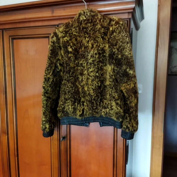 Blouson en cuir et mouton bouclé