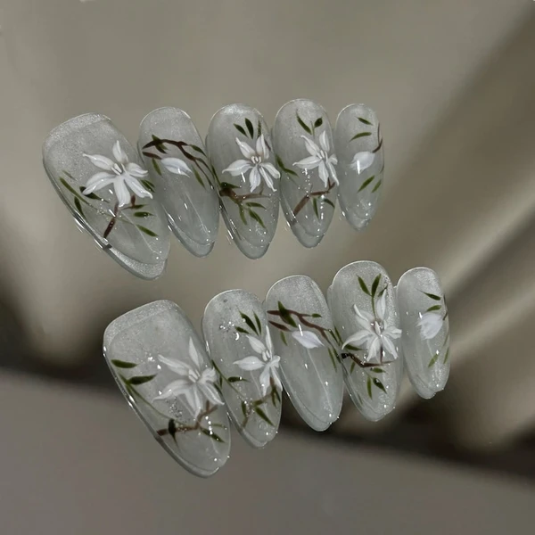 Presse de fleurs oeil de chat scintillantes fait main : ongles en gel personnalisés peints à la main