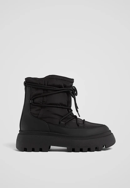 Bottines plates matelassées