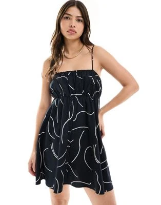 ASOS DESIGN - Robe d'été courte avec buste froncée et bretelles réglables - Imprimé abstrait noir et blanc | ASOS