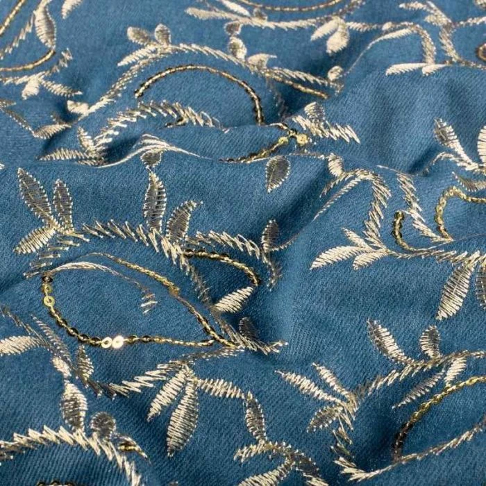 Tissu chambray brodé feuillages et sequins dorés