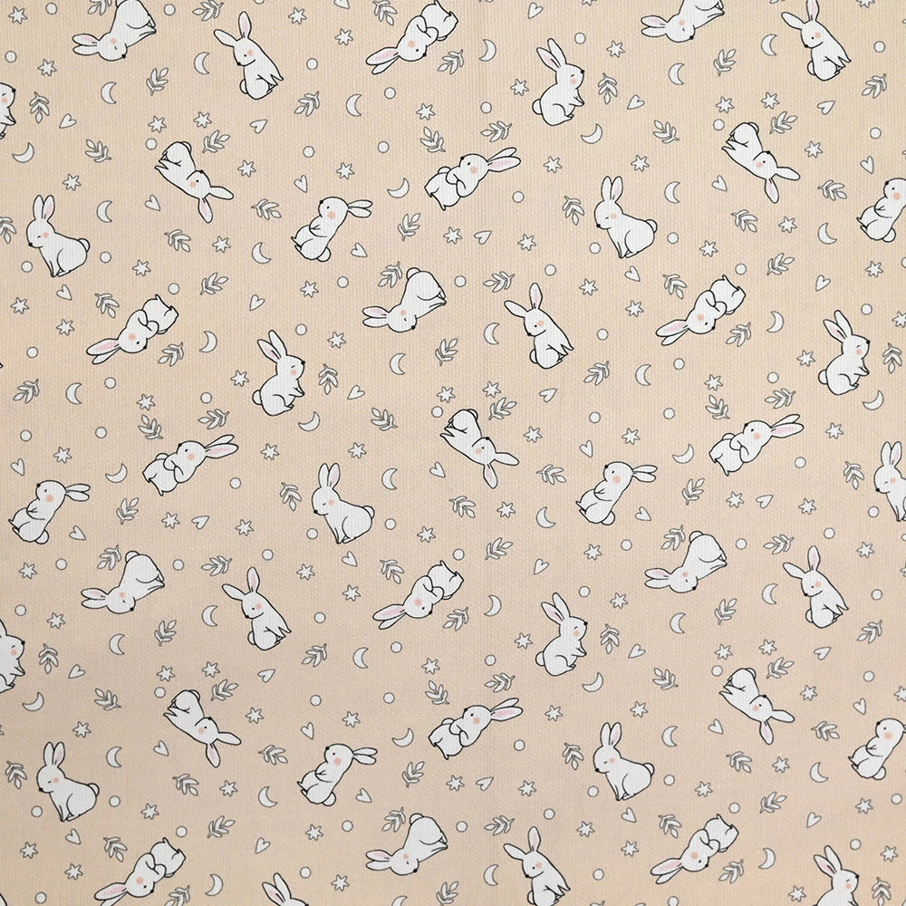 Piqué de coton imprimé jeune lapin fond beige