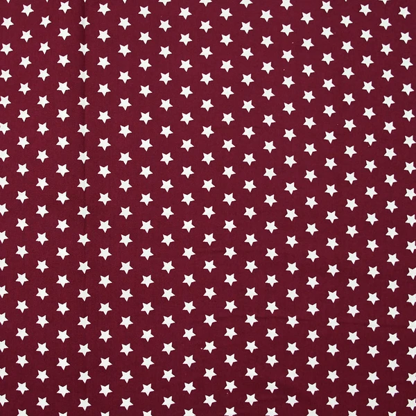 Popeline de coton imprimée étoiles fond bordeaux