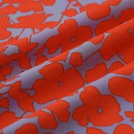 Tissu crêpe polyester fleuri orange bleu