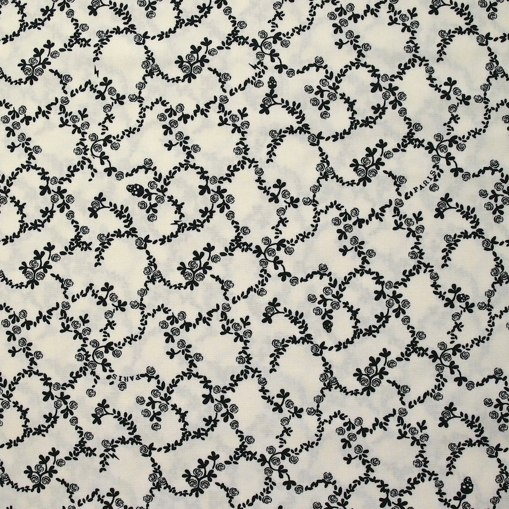 Viscose imprimée chaîne de fleurs fond blanc cassé