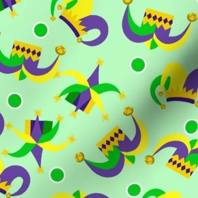 Tossed Jester Hats on Green Fabric | Spoonflower