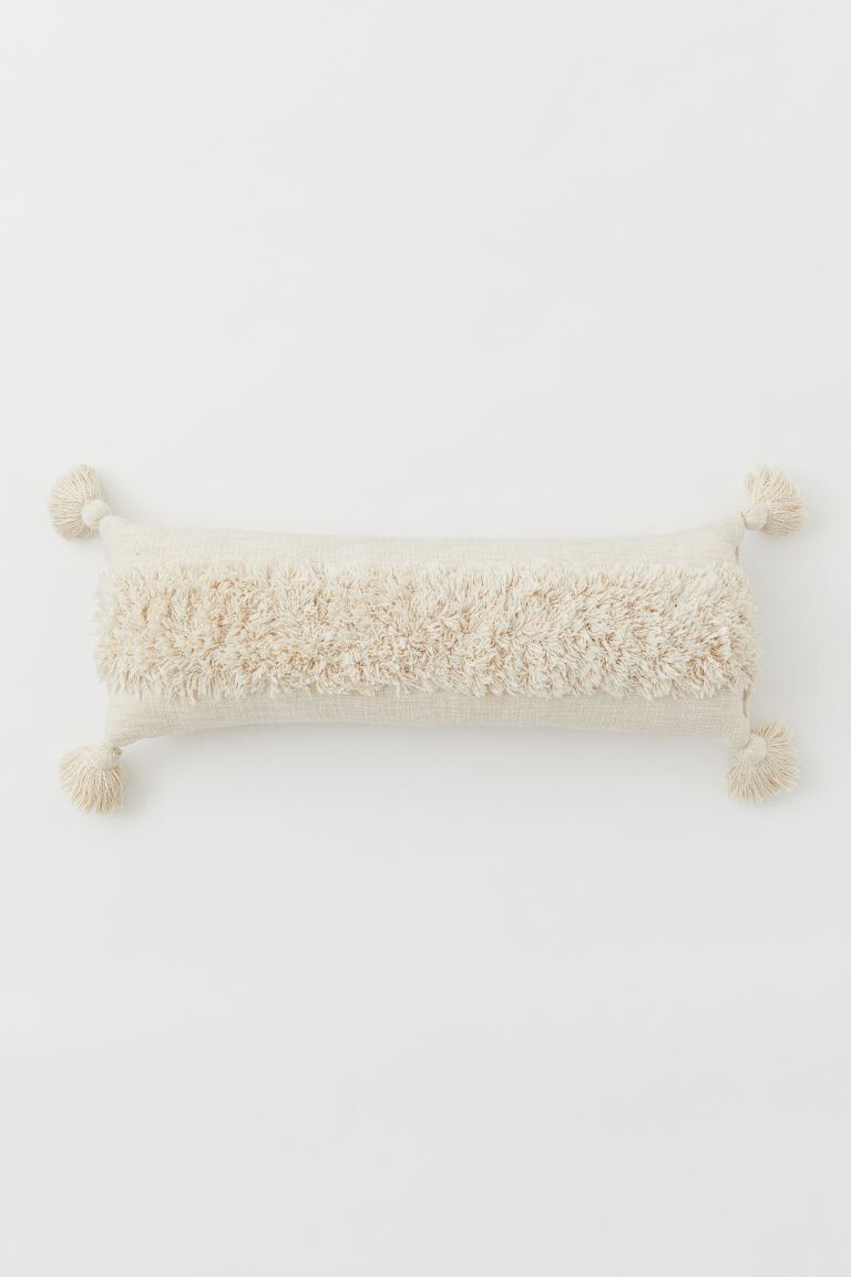 Coussin à pompons