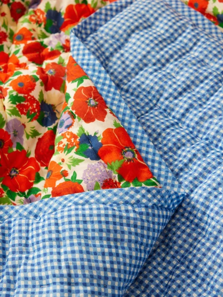 Spring flower reversible quilted blanket, Lucas du Tertre