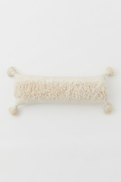 Coussin à pompons