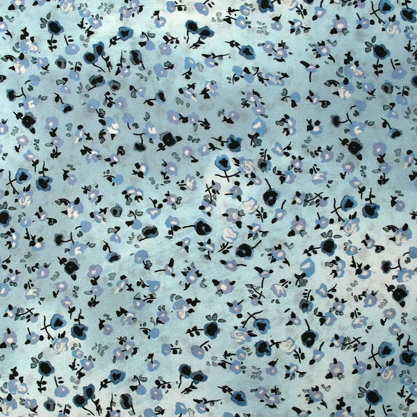 Voile de viscose imprimé fleurs dansantes fond bleu brumeux