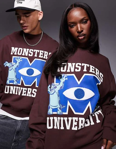 ASOS DESIGN - Disney Pixar - Sweat unisexe oversize coupe carrée à imprimé et broderie Monsters Inc - Marron