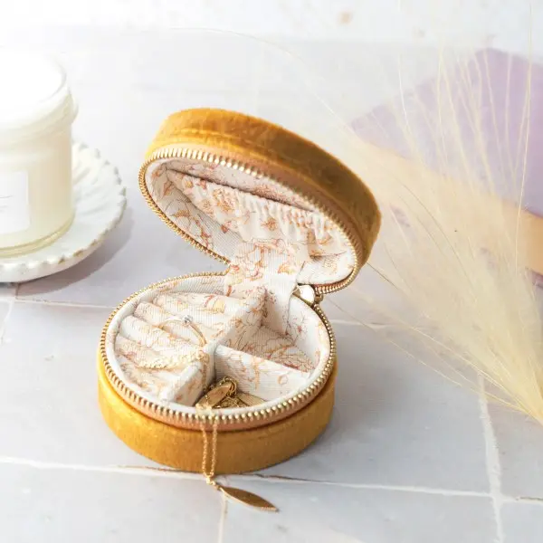Mustard velvet round travel jewellery box by Lisa Angel