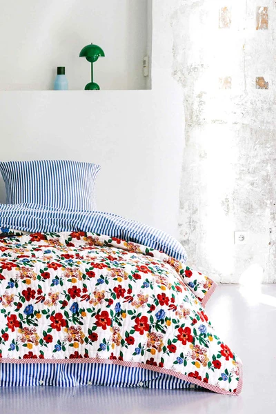 Hibiscus reversible quilted blanket, Lucas du Tertre