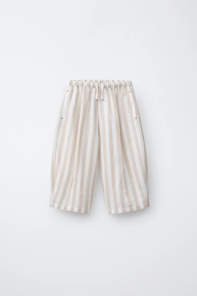 PANTALON BALLON À PLIS ET RAYURES