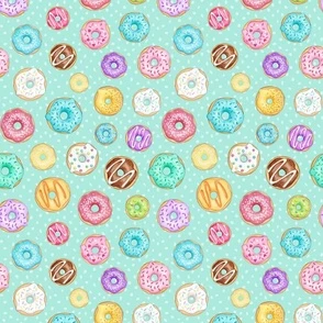 Scattered Rainbow Donuts on mint spotty Fabric | Spoonflower