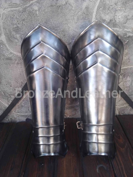 Pair of greaves. With blackening and scuffs.
