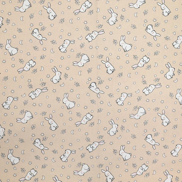 Piqué de coton imprimé jeune lapin fond beige