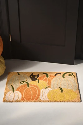 Paillasson imprimé chat noir dans un champ de citrouilles en fibre de coco