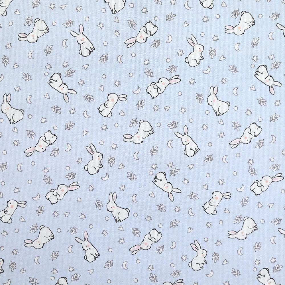 Piqué de coton imprimé jeune lapin fond bleu clair
