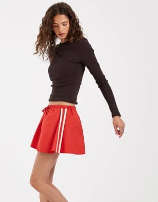 ASOS DESIGN - Mini-jupe technique avec rayures latérales - Rouge