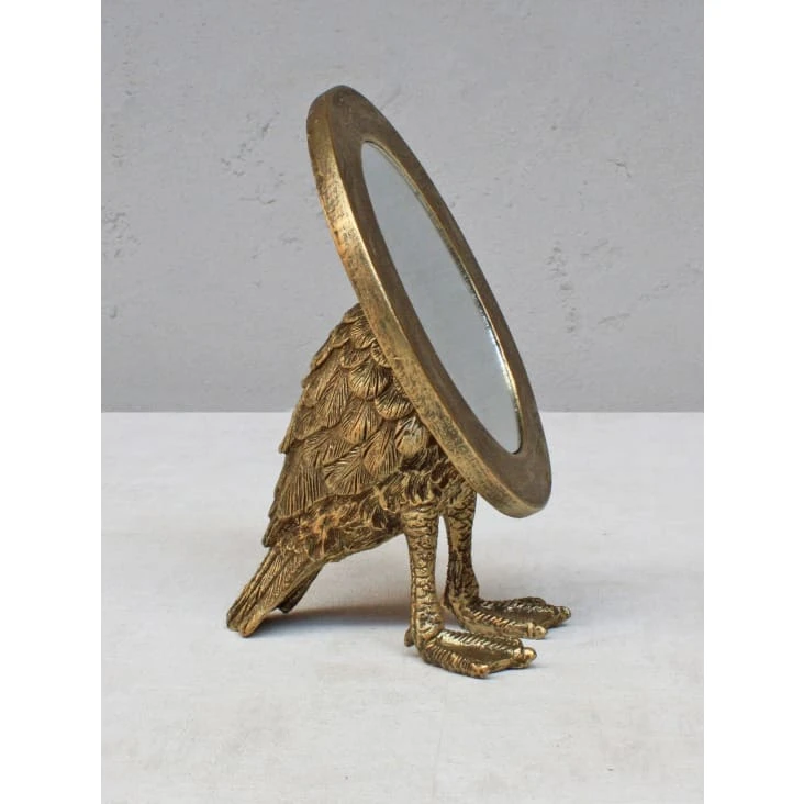 Miroir ovale en métal doré