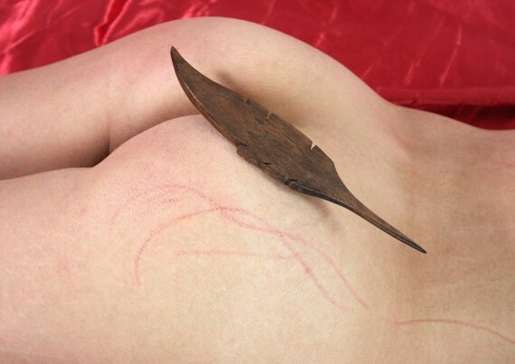 BDSM feather, special scratches and writings on the skin
