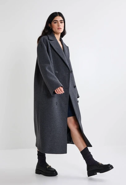 Manteau uni double boutonnage contenant de la laine