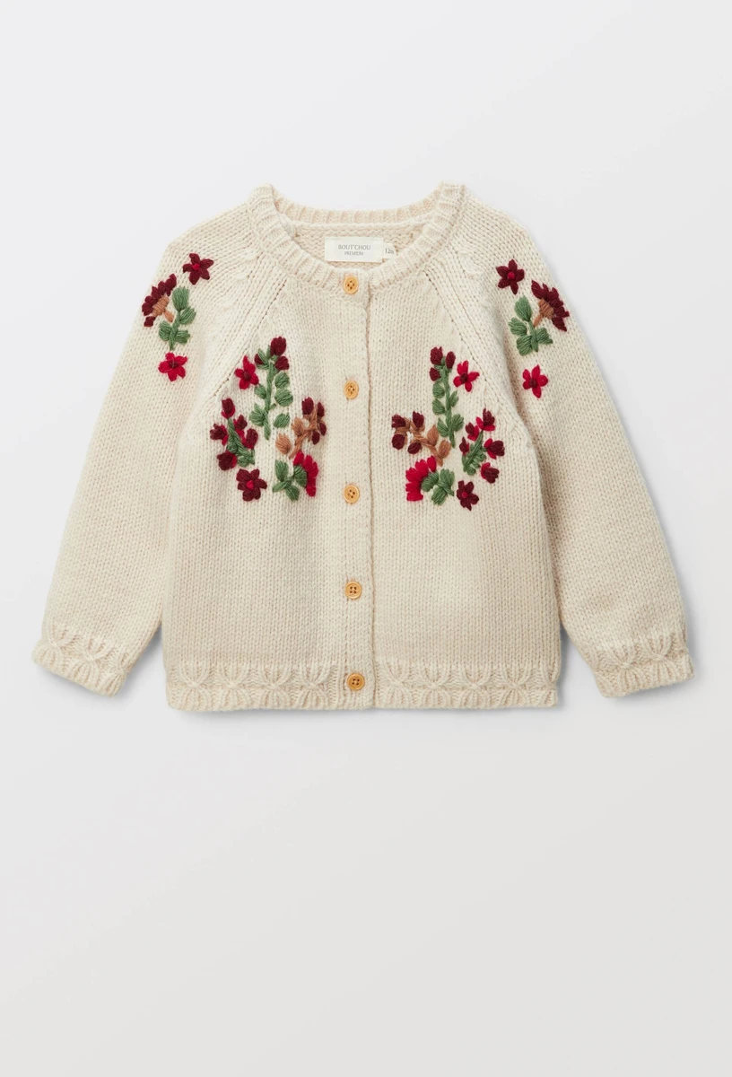 Cardigan tricot brodé contenant de la laine
