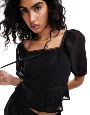 Miss Selfridge - Blouse champêtre en mousseline avec broderies - Noir | ASOS