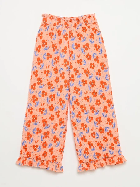 Pantalon large avec bas volantés