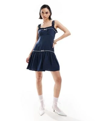ASOS DESIGN - Robe courte à bretelles, ourlet virevoltant et rubans - Bleu marine | ASOS
