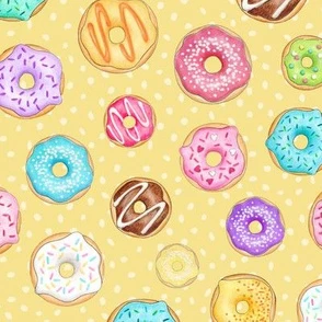 Scattered Rainbow Donuts on lemon yellow Fabric | Spoonflower