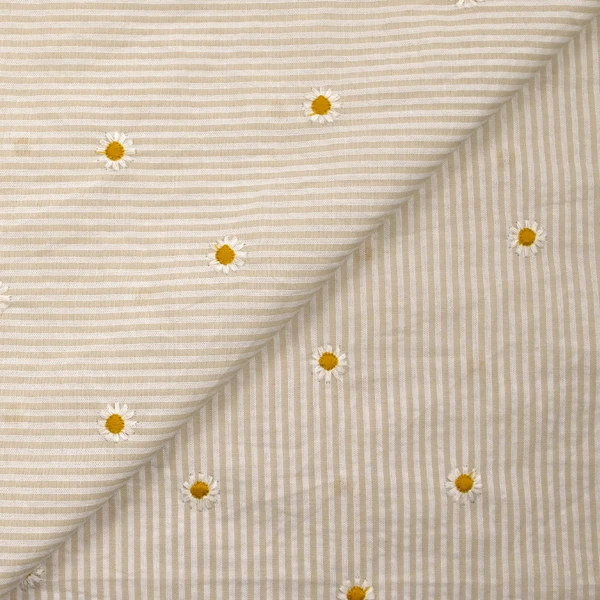 Coton tissé teint brodé marguerite fond rayé blanc et beige
