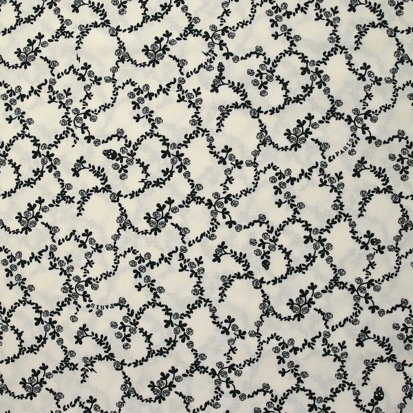 Viscose imprimée chaîne de fleurs fond blanc cassé